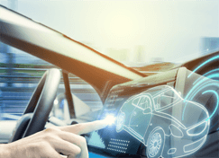 woman's hand touching hologram of car on vehicle dashboard