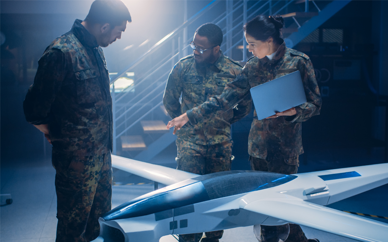solders around a small airplane