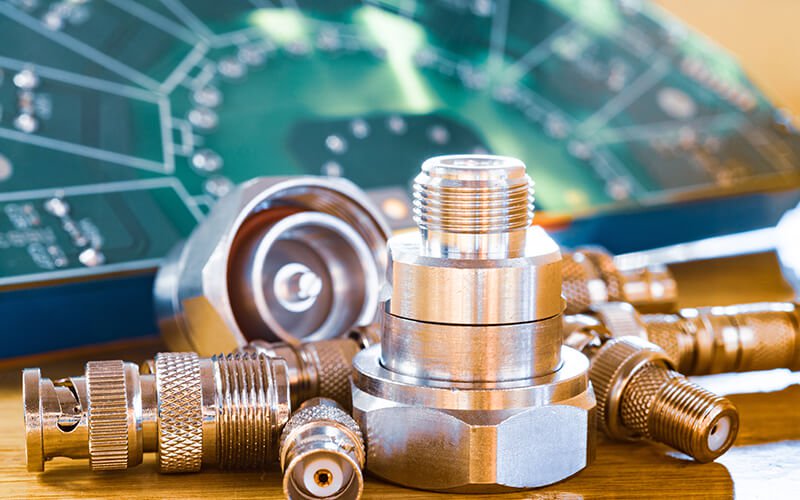 A collection of gleaming metallic connectors