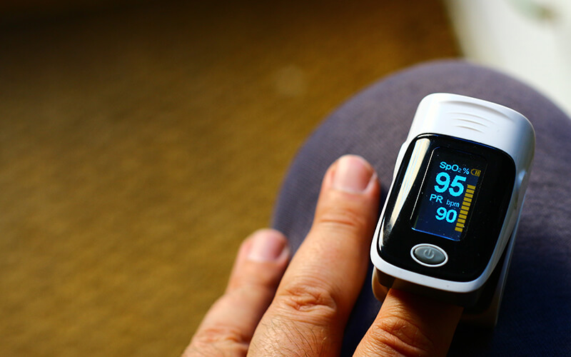 Blood pressure finger cuff getting a person's reading