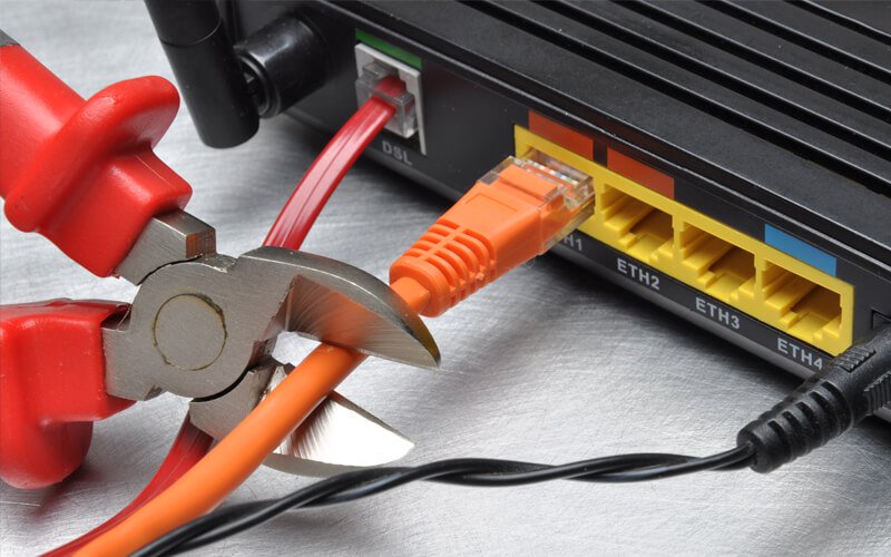 ethernet cable on a router being cut