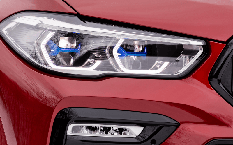 left side of the front of a car, showing the headlights