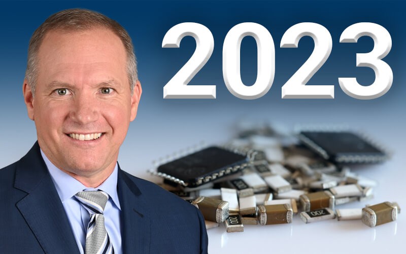 John Drabik, TTI President in front of capacitors and the year 2023